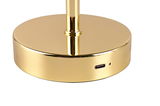 Nahaufnahme der goldenen Basis einer Akku-Tischleuchte mit USB-Anschluss.