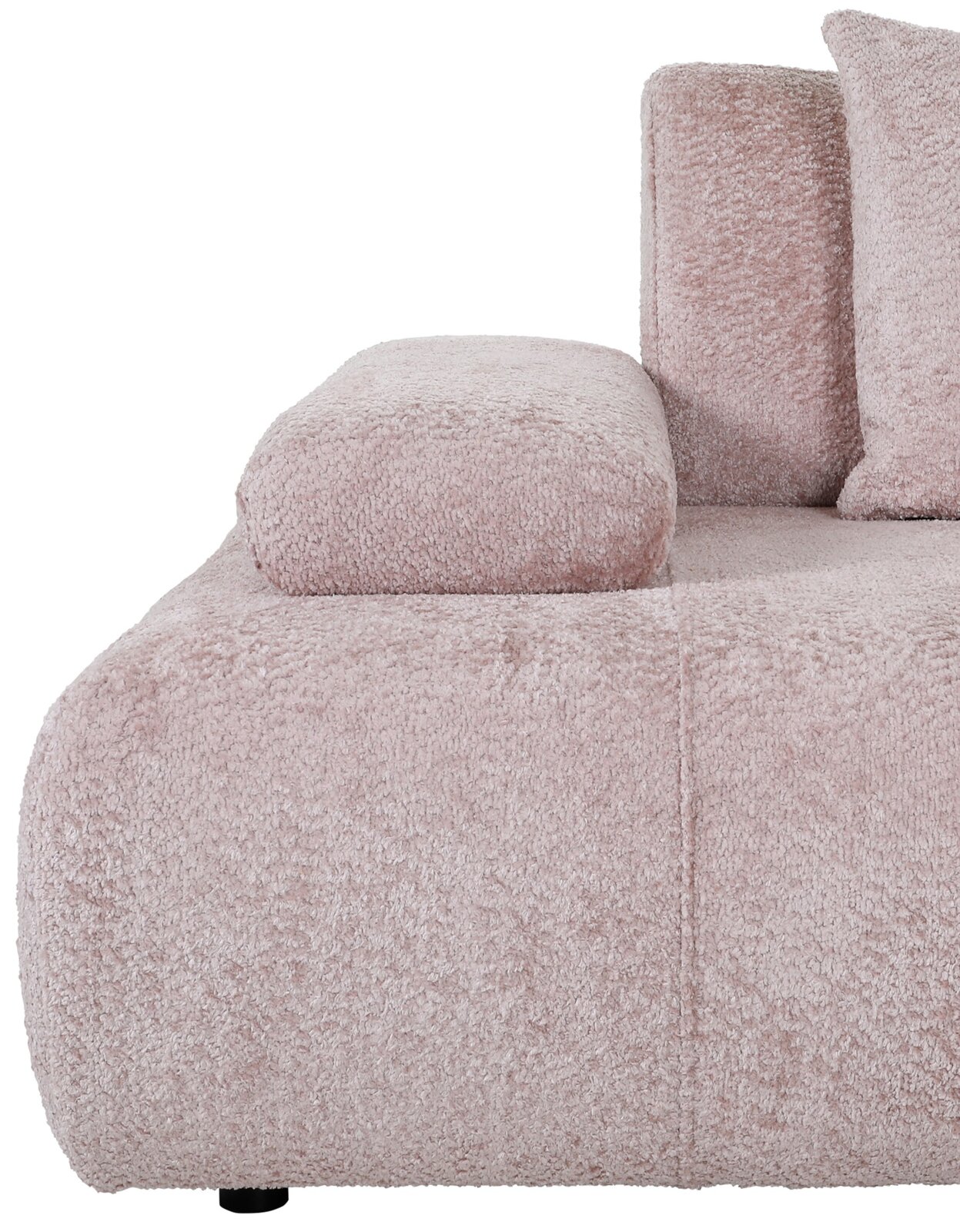 Nahaufnahme eines rosa Sofas mit weicher, texturierter Oberfläche und Armlehne, seitliche Perspektive