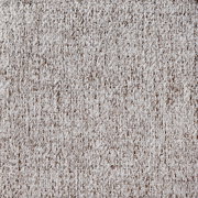 Nahaufnahme eines beigen, strukturierten Stoffes, der für einen Armlehnstuhl verwendet wird.