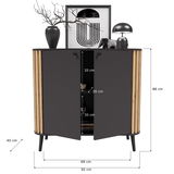 Moderne Kommode mit schwarzer Front und Holzdetails, dekoriert mit Vase, Kunstwerk und Lampe, frontal abgebildet.