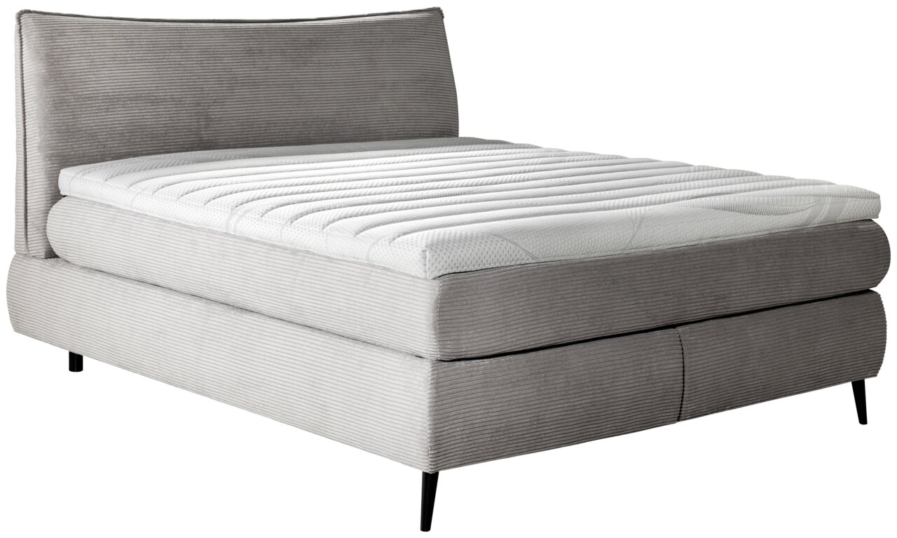 Boxspringbett 180x200 in grauem Stoff mit gestepptem Kopfteil, seitliche Perspektive