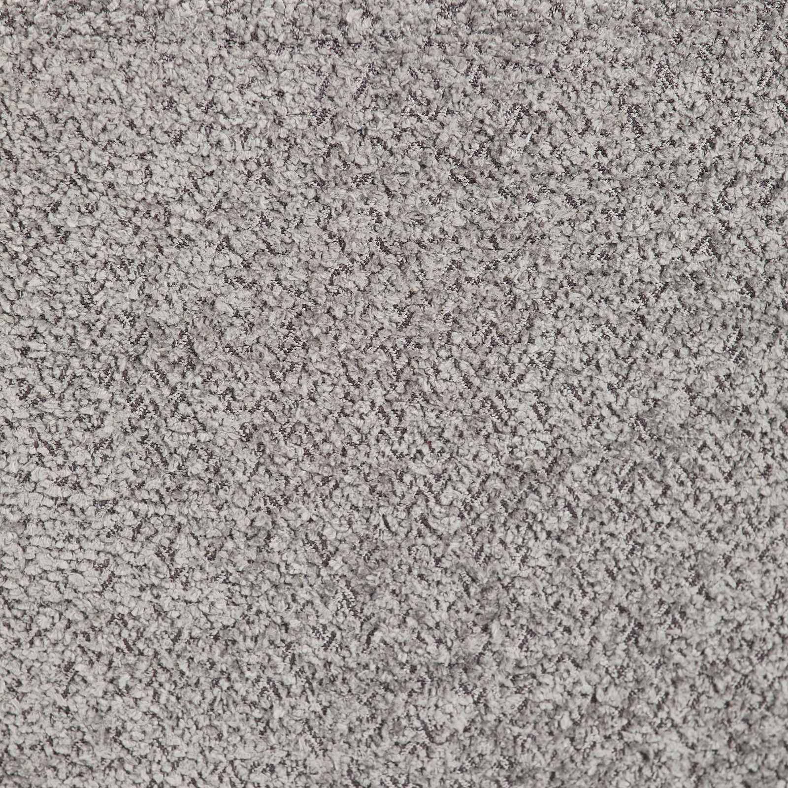 Nahaufnahme einer grauen, strukturierten Teppichoberfläche.