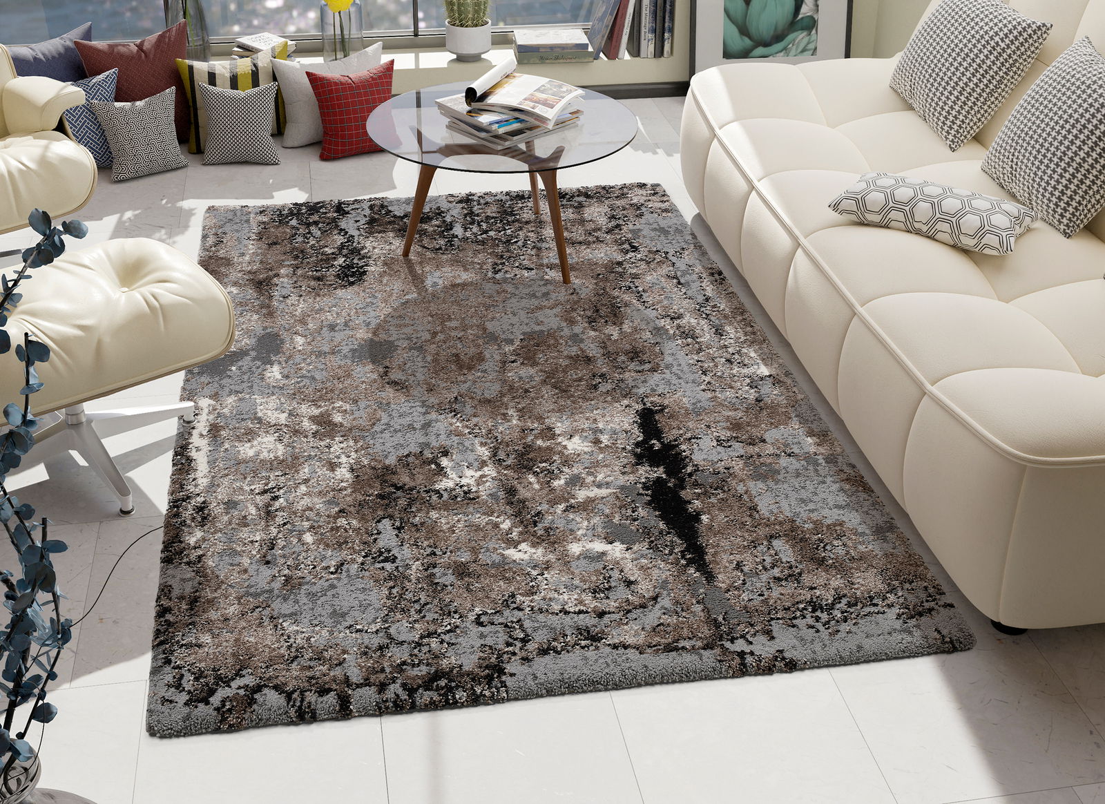 Moderner Teppich Juwel Liray in einem stilvollen Wohnzimmer, umgeben von einem weißen Sofa und einem Glastisch, aus der Vogelperspektive betrachtet.
