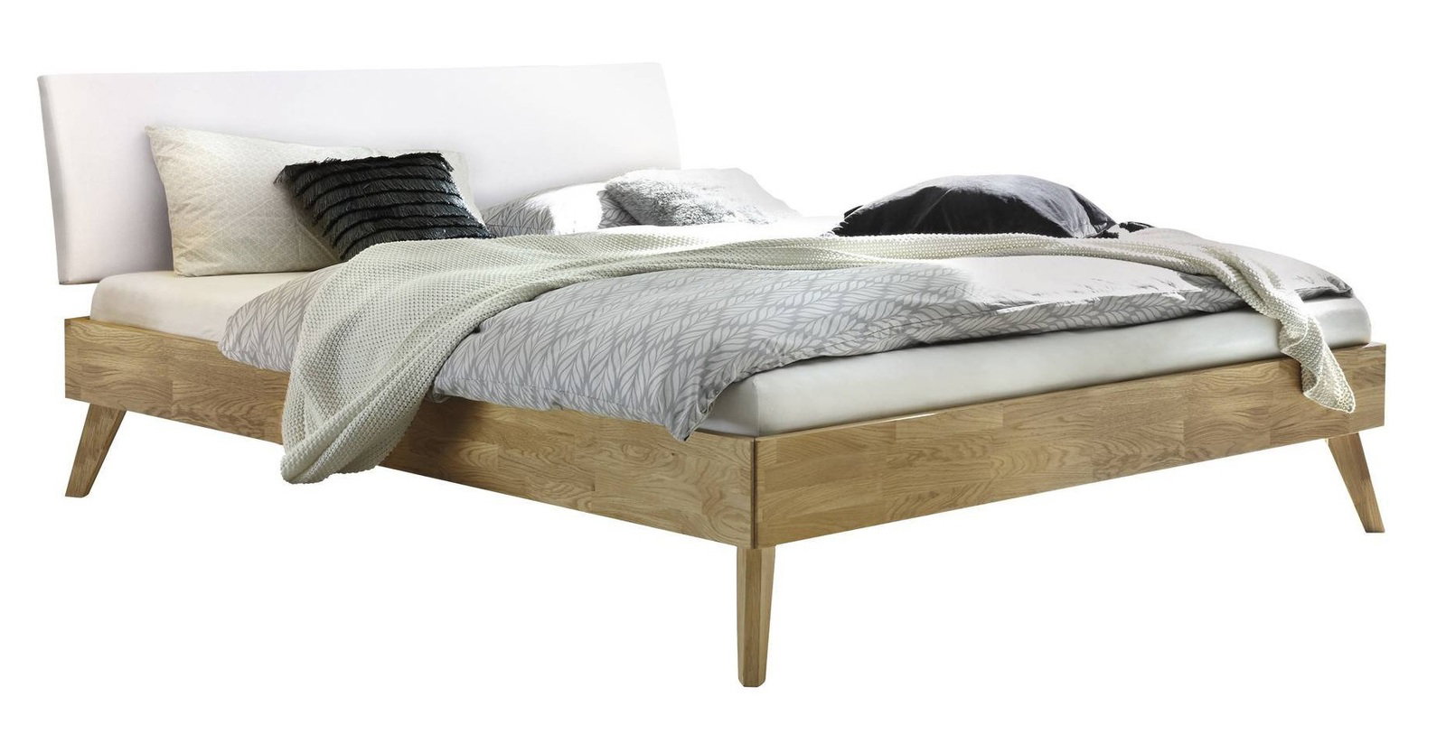 Modernes Bettgestell aus Holz mit weißem Kopfteil, seitliche Perspektive