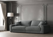 Graues Big-Sofa in einem eleganten Wohnzimmer mit klassischer Wandverkleidung, seitliche Perspektive