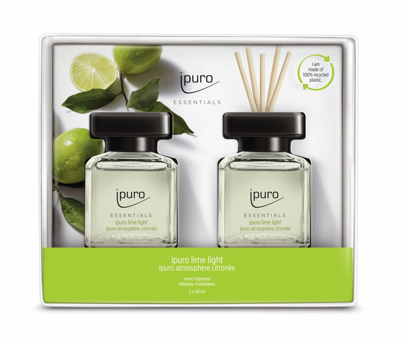 Zwei Flaschen Lime Light Raumduft mit schwarzen Verschlüssen und Duftstäbchen, präsentiert in einer Verpackung mit Limettenmotiv, aus der Vorderansicht.