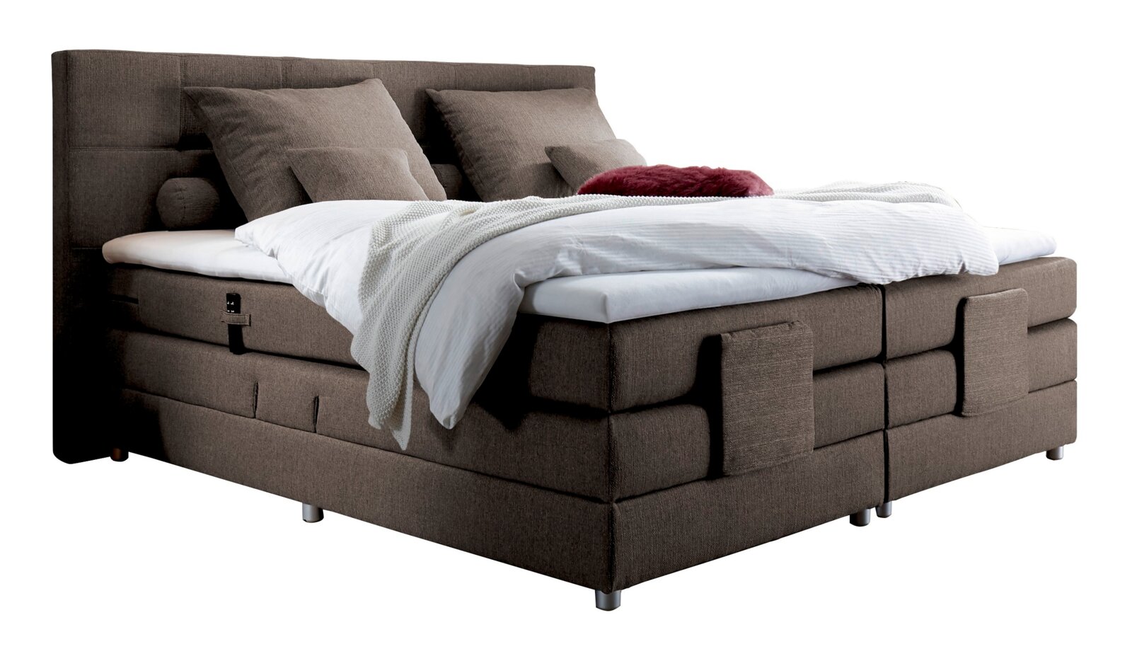 Boxspringbett in braunem Stoffbezug mit Kopfteil, seitliche Perspektive