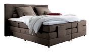 Boxspringbett in braunem Stoffbezug mit Kopfteil, seitliche Perspektive