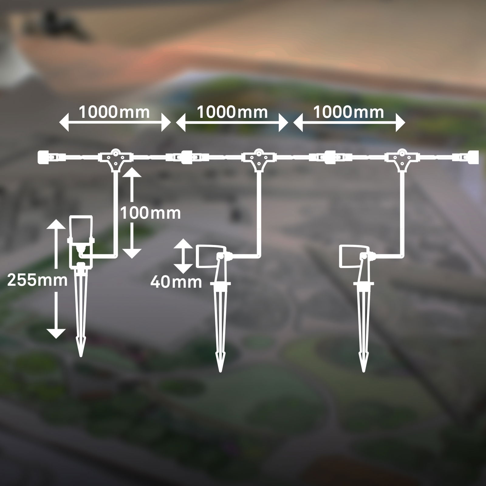 Diagramm eines Bodenspikes-Extensionsets mit drei Einheiten, die in einer Linie angeordnet sind. Jede Einheit hat eine Länge von 1000 mm und ist mit einem Erdspieß ausgestattet. Die Perspektive zeigt eine schematische Darstellung von oben.