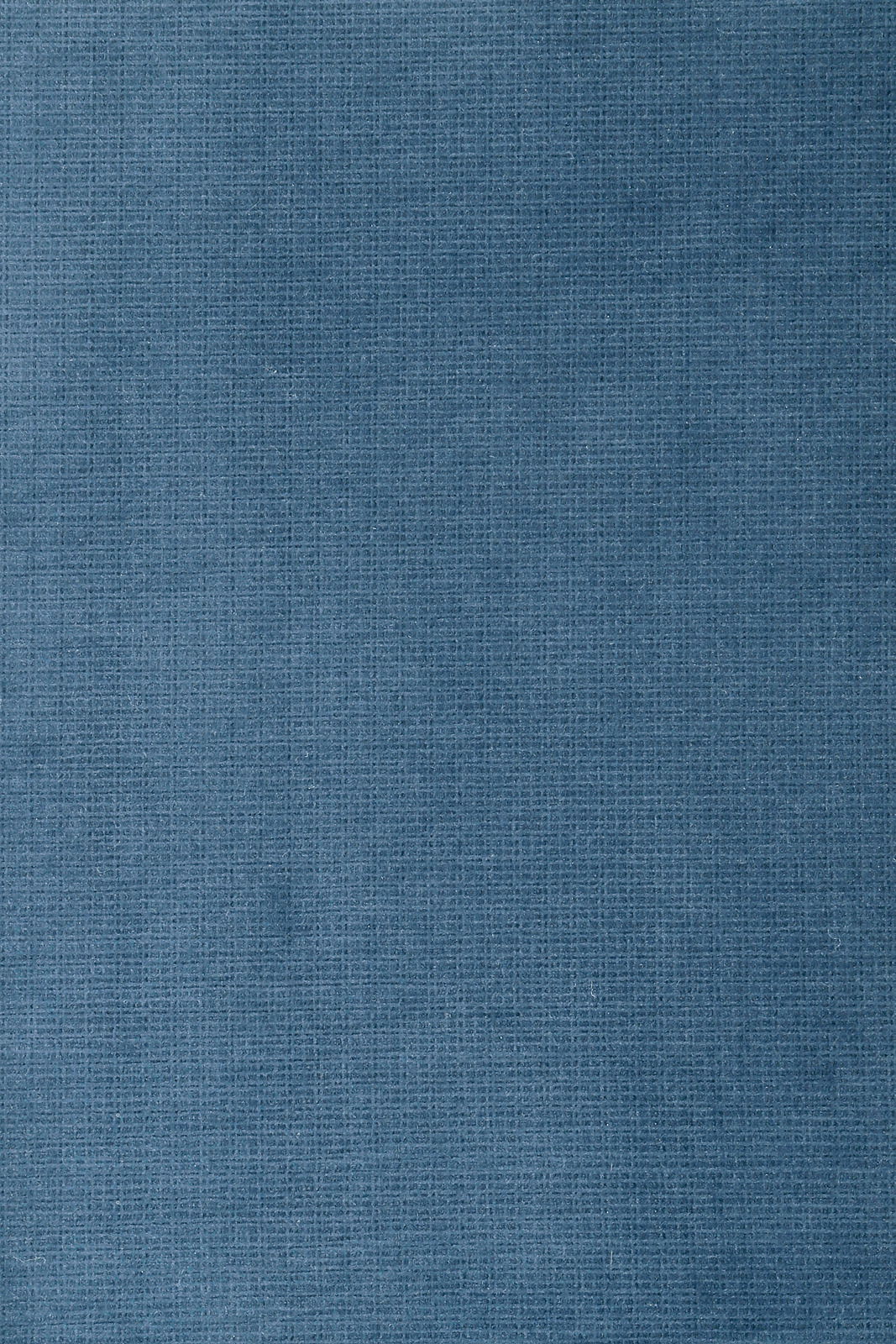 Nahaufnahme eines blauen Stoffes mit feiner Textur