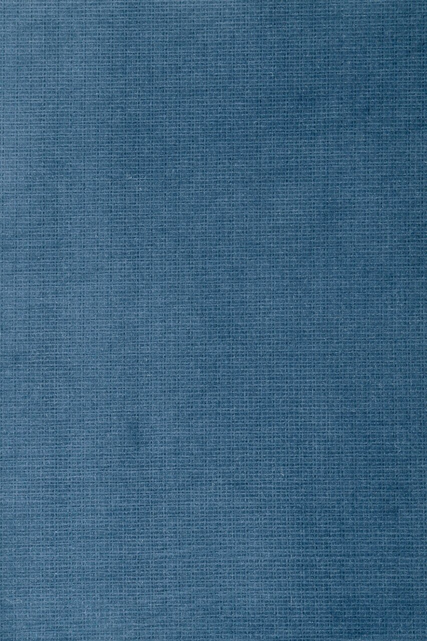 Nahaufnahme eines blauen Stoffes mit feiner Textur