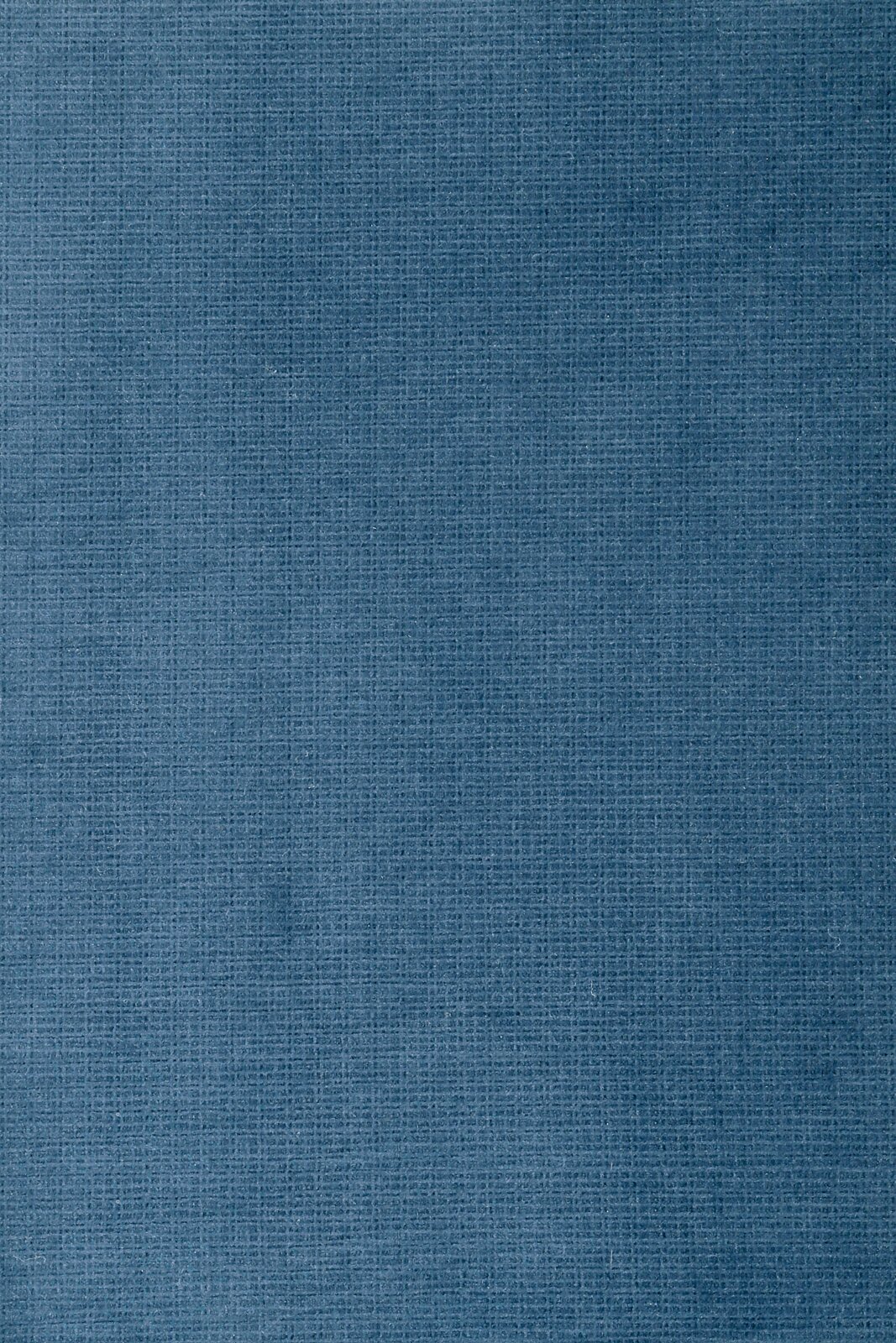 Close-up van een blauwe stof met een fijne structuur