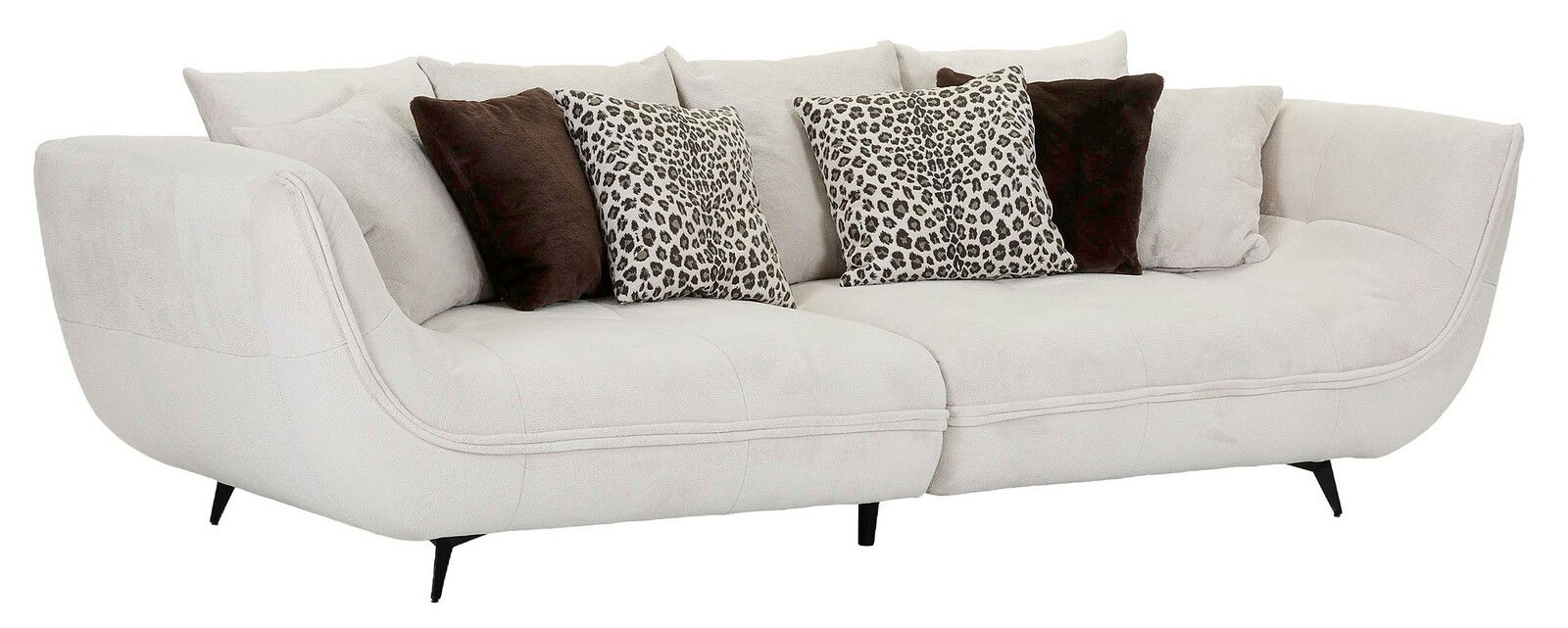 Stylife Big Sofa LAVOS Großes, modernes Megasofa in hellem Stoff mit geschwungenen Armlehnen, dekoriert mit gemusterten und einfarbigen Kissen, seitliche Perspektive.