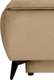 Nahaufnahme eines beigefarbenen, stoffbezogenen Polstermöbels mit schwarzem Metallfuß, seitliche Ansicht