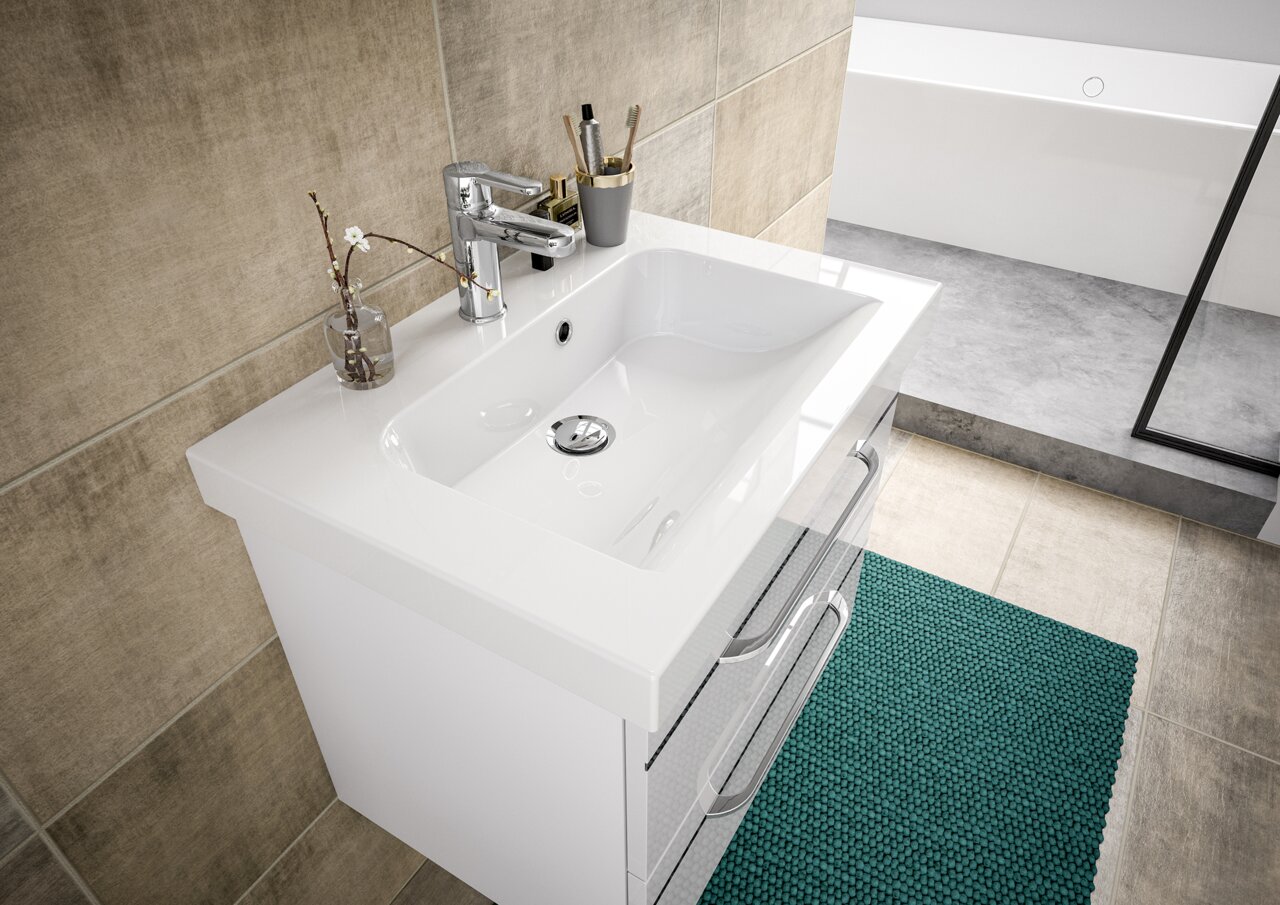 Moderne Waschtischlösung mit weißem Waschbecken und Chromarmatur, von oben fotografiert.