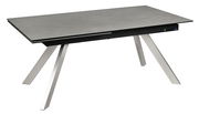 Moderner Esstisch mit grauer Tischplatte und schrägen Metallbeinen, seitliche Perspektive