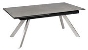 Moderner Esstisch mit grauer Tischplatte und schrägen Metallbeinen, seitliche Perspektive