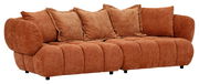 Großes, gemütliches Big-Sofa in braunem Stoff mit mehreren Kissen, seitliche Perspektive.