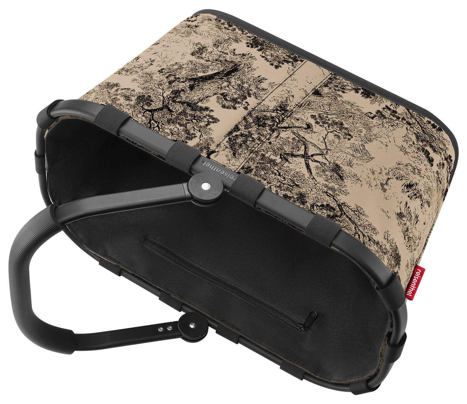 Carrybag mit schwarzem Griff und einem beige-schwarzen, baumartigen Muster, von oben betrachtet.