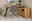 Novel Eckschreibtisch-Kombination X-TREME D 145 E Eck-Schreibtisch-Kombination aus Holz mit schwarzem Metallgestell, grauem Drehstuhl und dekorativen Accessoires, seitliche Perspektive