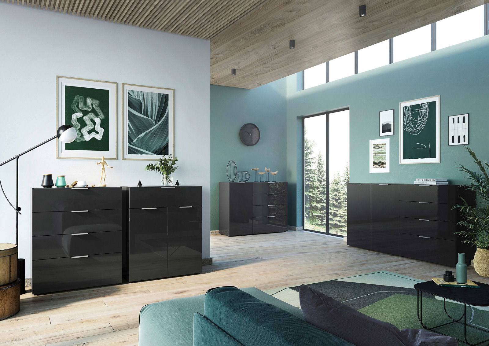 Modernes Wohnzimmer mit mehreren schwarzen Sideboards, darunter das XL-Sideboard Germania Sideboard OLEA, in einer stilvollen, hellen Umgebung mit großen Fenstern und dekorativen Elementen. Perspektive von vorne links.