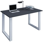 Moderner Schreibtisch mit dunkelgrauer Tischplatte und silbernen U-förmigen Metallbeinen, darauf Laptop, schwarze Tischlampe und Ablagekorb; Perspektive: leicht von vorne links in schräger Ansicht.