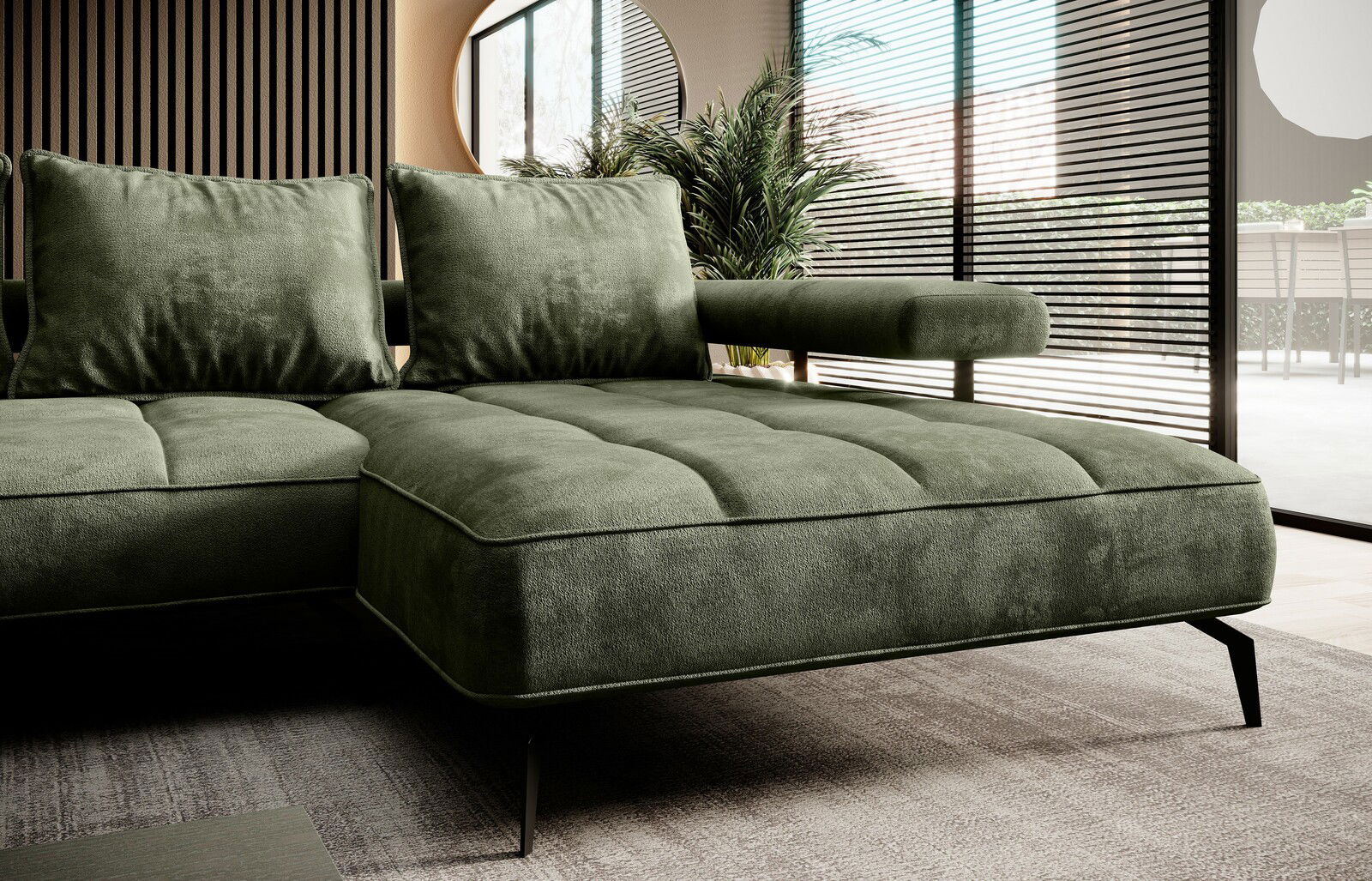 Grüne Longchairkombination in modernem Wohnzimmer, seitliche Perspektive mit Blick auf Kissen und Armlehne.