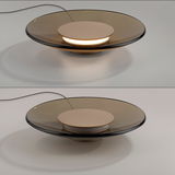 Moderne Tischleuchte PURE Moon mit runder, flacher Form und sanftem Licht, seitliche Perspektive