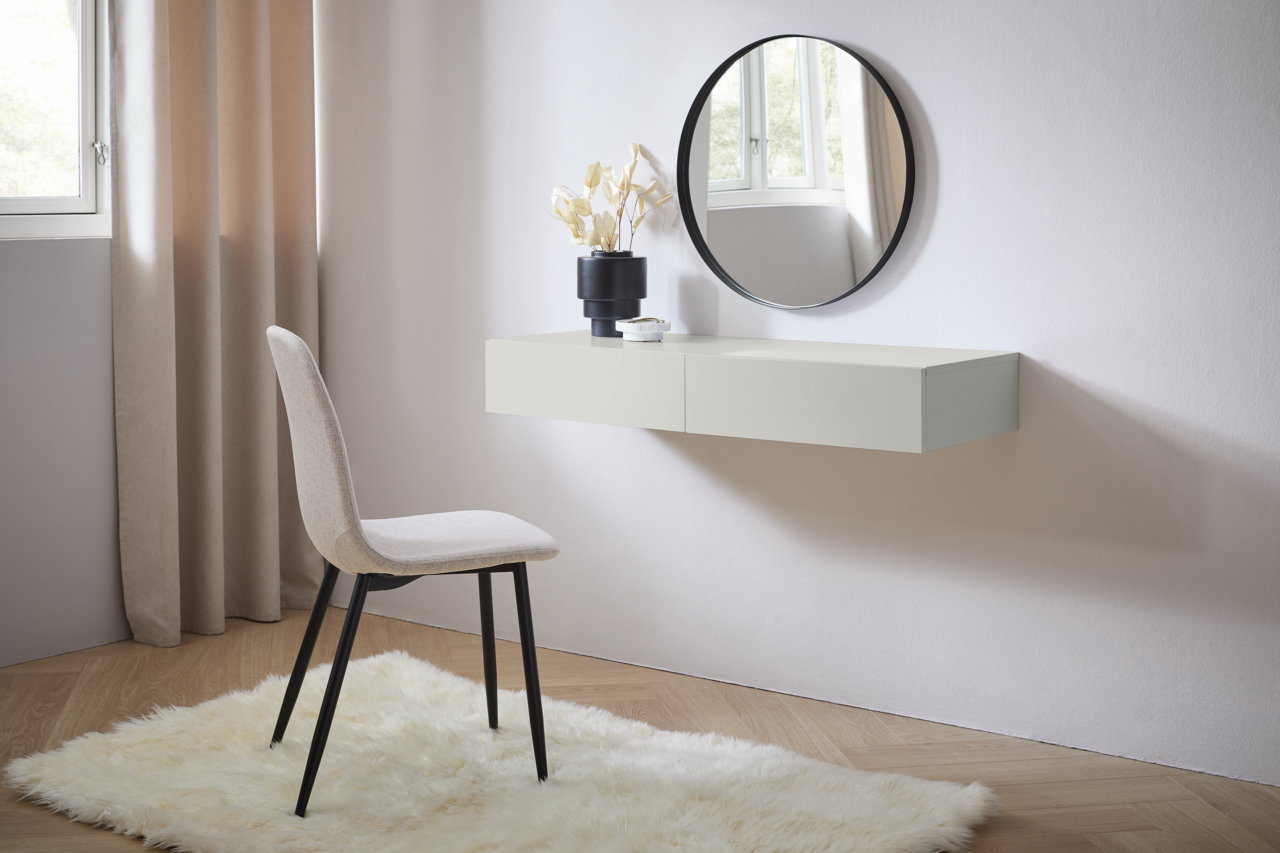 Moderne Wandkonsole in hellem Raum, seitliche Perspektive, mit rundem Spiegel und Dekoration.