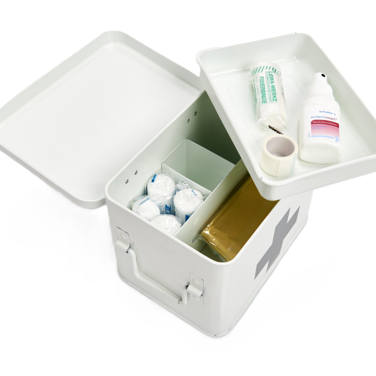Geöffnete weiße Metall-Medizinbox mit Erste-Hilfe-Inhalten, von oben betrachtet