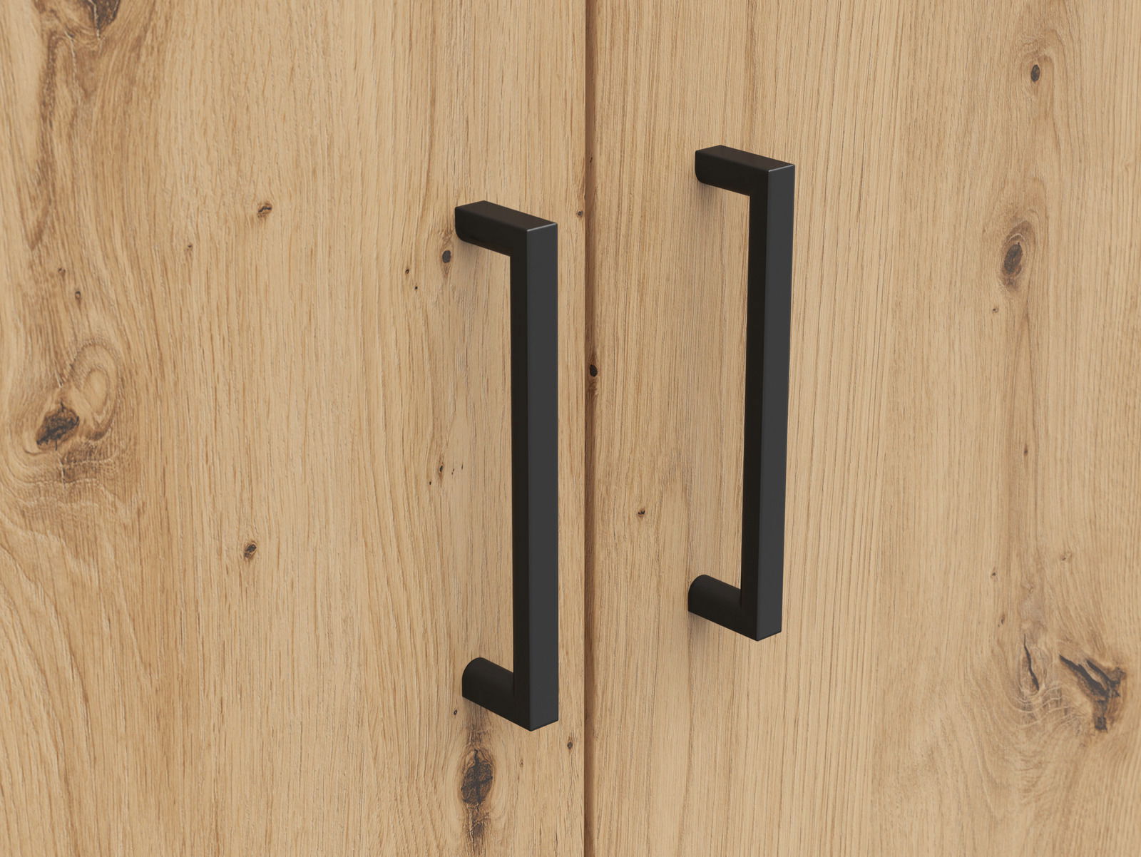 Nahaufnahme von zwei schwarzen Griffen auf einer Holzoberfläche eines Mehrzweckschranks, von vorne betrachtet.