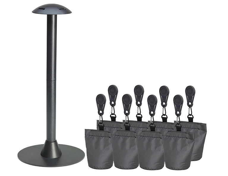 Abstandshalter-Set bestehend aus einem hohen, runden Ständer und mehreren schwarzen Gewichtsbeuteln mit Clips, seitliche Perspektive.