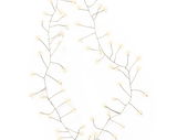 Nahaufnahme von einer Micro LED Lichterkette mit warmweißen Lichtern, die in einem geschwungenen Muster angeordnet ist.