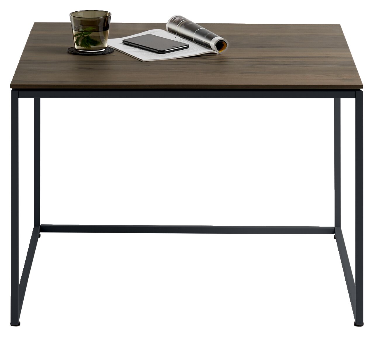 Johann Jakob Beistelltisch LANDO Moderner Beistelltisch mit dunkler Holzplatte und schwarzem Metallgestell, frontal fotografiert. Auf dem Tisch stehen ein Glas, ein Notizbuch und eine zusammengerollte Zeitschrift.