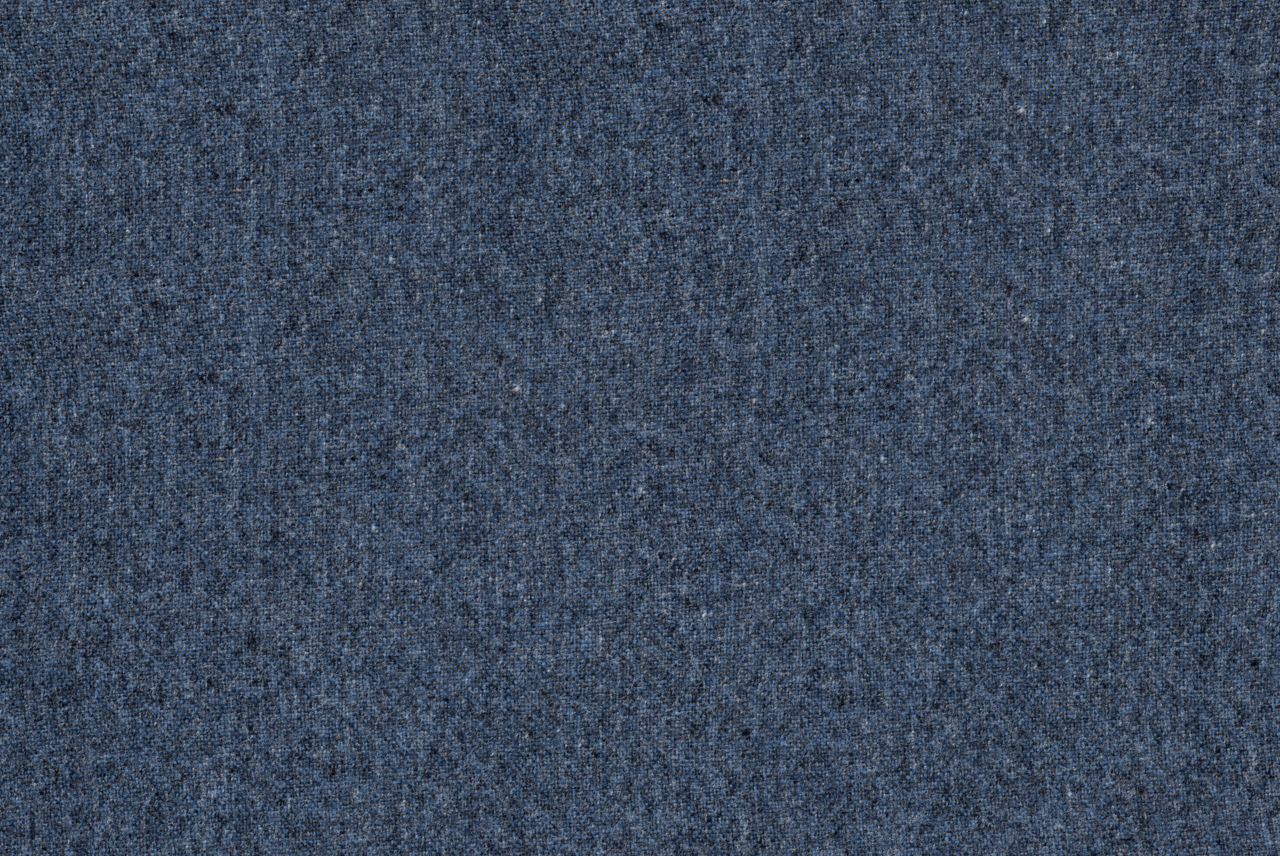 Nahaufnahme eines blauen Stoffmusters, das für einen Chefsessel verwendet wird.