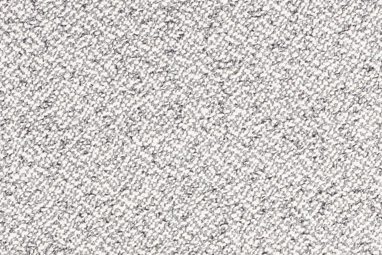 Nahaufnahme eines grauen, strukturierten Stoffes, der für einen Hocker verwendet wird.