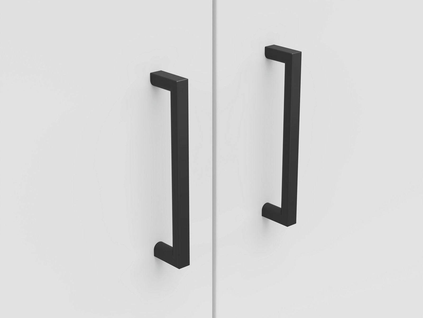 Carryhome Kommode MULTISTAURAUM Nahaufnahme von zwei schwarzen, modernen Griffen auf einer weißen Kommodenoberfläche, frontal betrachtet.