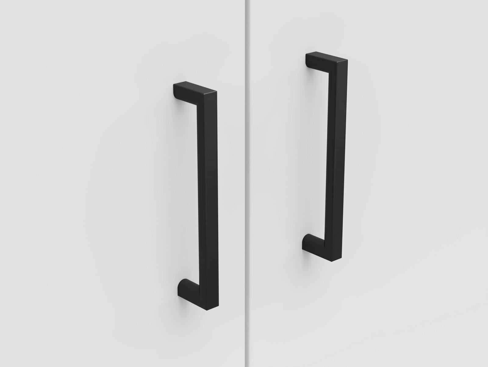 Carryhome Kommode MULTISTAURAUM Nahaufnahme von zwei schwarzen, modernen Griffen auf einer weißen Kommodenoberfläche, frontal betrachtet.