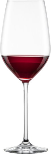 Bordeaux Rotweinglas mit rotem Wein, frontal fotografiert