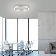 Moderne runde Deckenleuchte in einem minimalistischen Büro, seitliche Perspektive