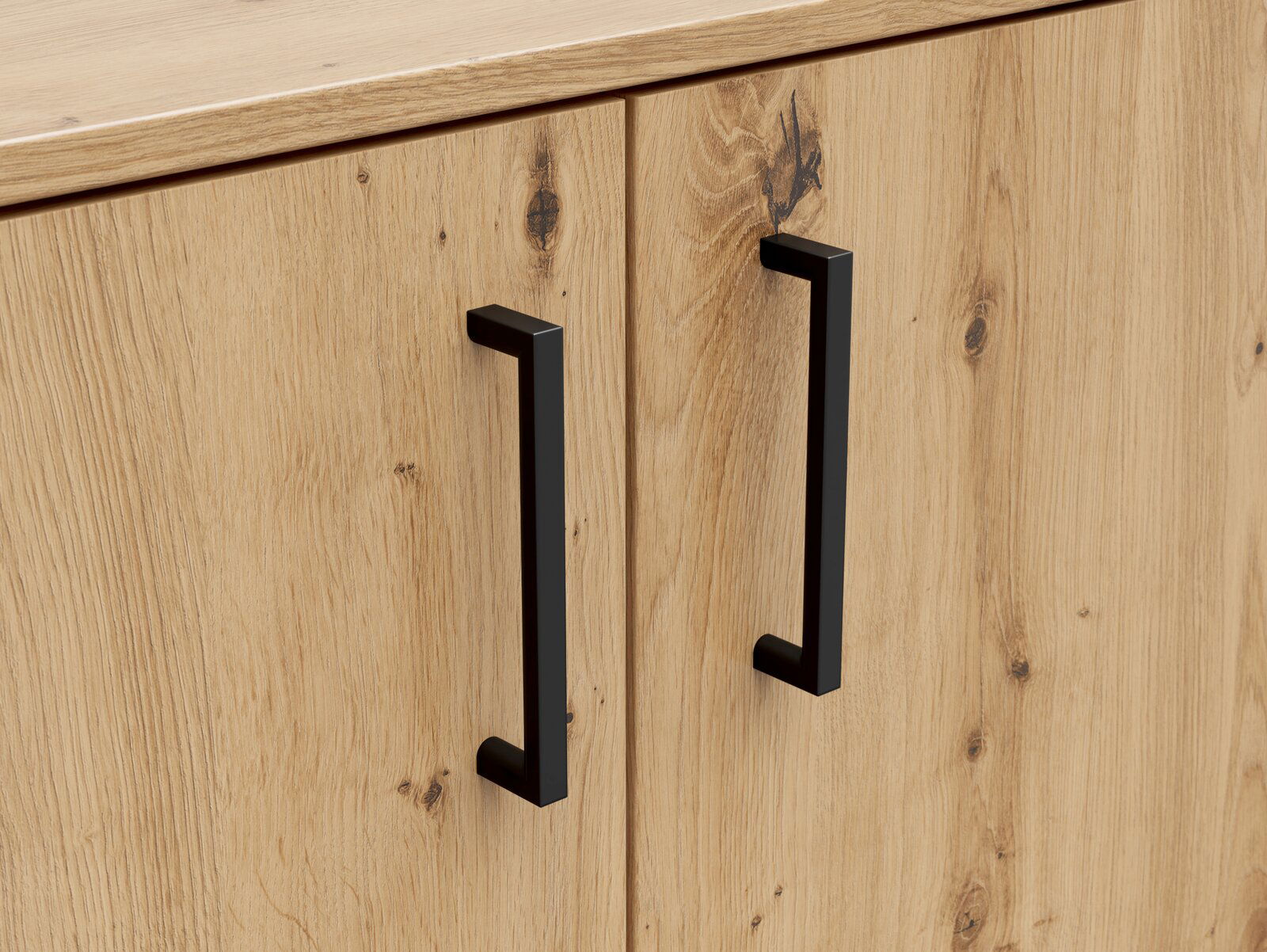 Nahaufnahme einer Kommode aus hellem Holz mit zwei schwarzen, modernen Griffen. Perspektive von vorne.
