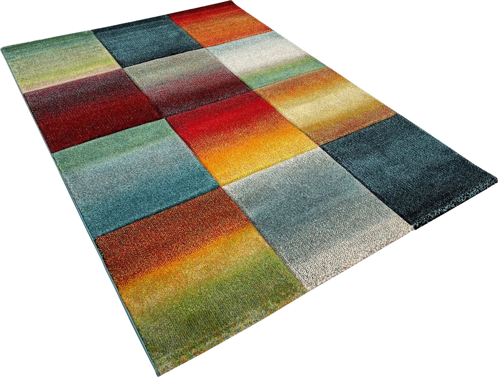Merinos Kurzflorteppich BELIS Bunter Teppich im Patchwork-Design mit farbigen Quadraten in Rot, Blau, Grün, Gelb und Grau, schräg von oben in Perspektive fotografiert