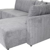 Graues Sofa mit rechter Armlehne, Perspektive von der Seite