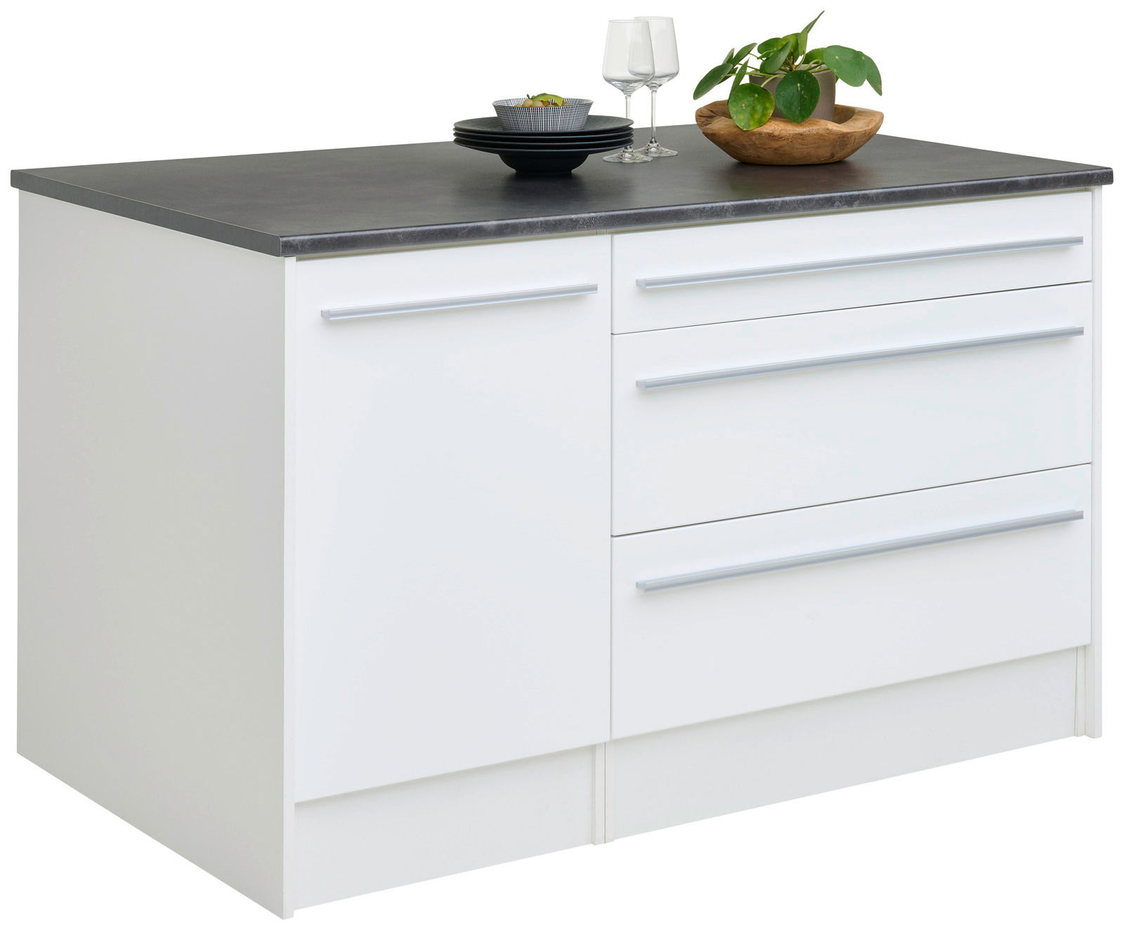 Weiße Kücheninsel mit dunkler Arbeitsplatte, zwei Schubladen und einer Tür, dekoriert mit Geschirr und Pflanze, seitliche Perspektive