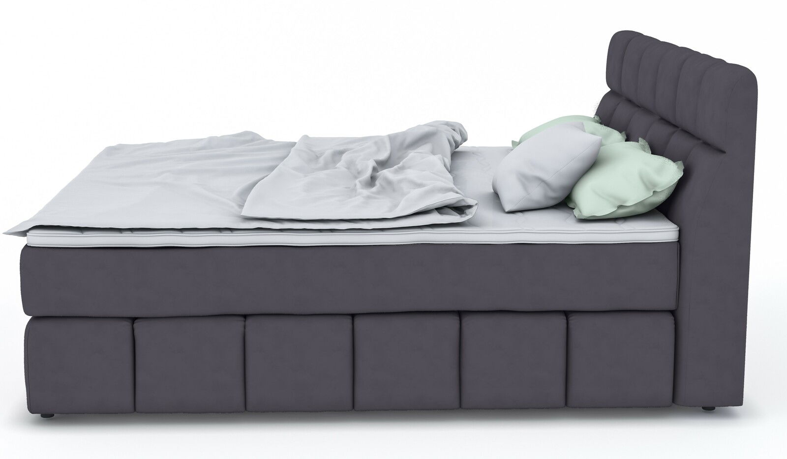Seitliche Ansicht eines grauen Boxspringbetts mit hohem Kopfteil und mehreren Kissen.