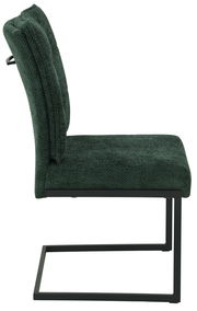 Seitenansicht eines modernen Schwingstuhls mit grünem Stoffbezug und schwarzem Metallgestell.