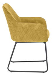 Seitenansicht eines gelben Kufenstuhls mit gestepptem Stoffbezug und schwarzem Metallgestell.