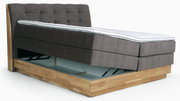 Boxspringbett mit Stauraum, seitliche Perspektive, grauer Stoffbezug, Holzrahmen