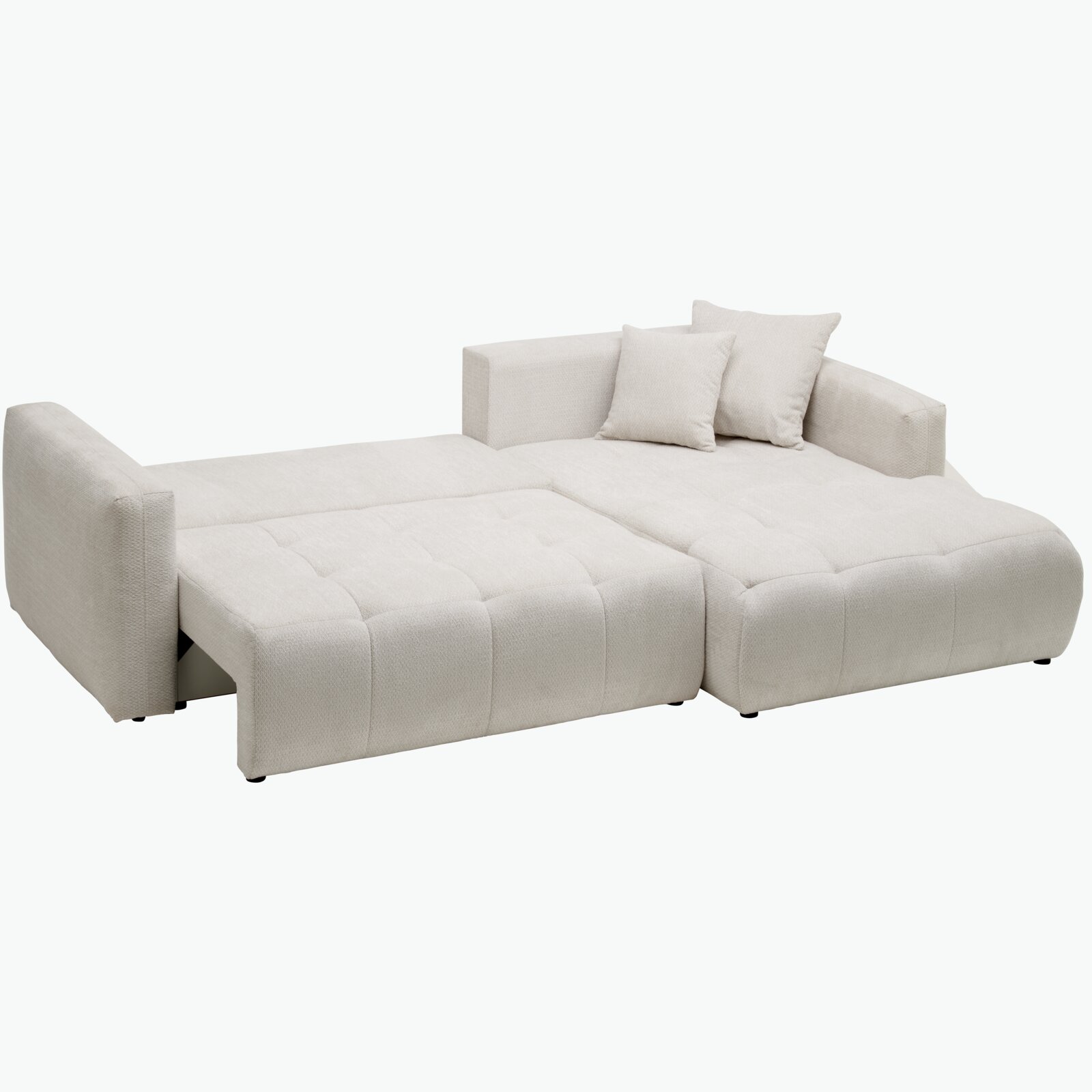 Beige Ecksofa in Liegeposition mit zwei Kissen, seitliche Perspektive