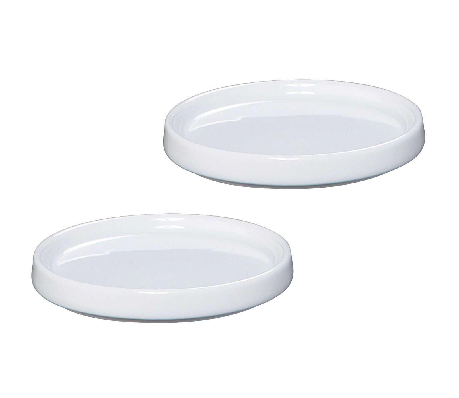 Zwei weiße Porzellan-Mühlenuntersetzer, von oben betrachtet.